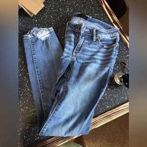 Buckle Jeans with distressed ankle